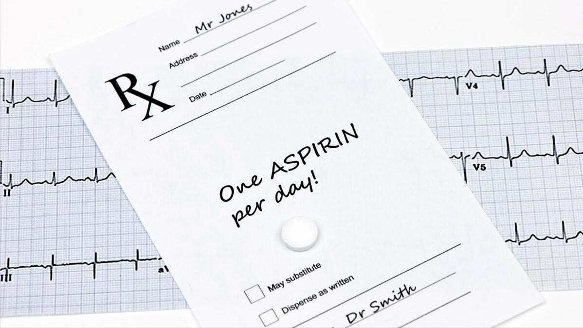 Taking low-dose aspirin with meals