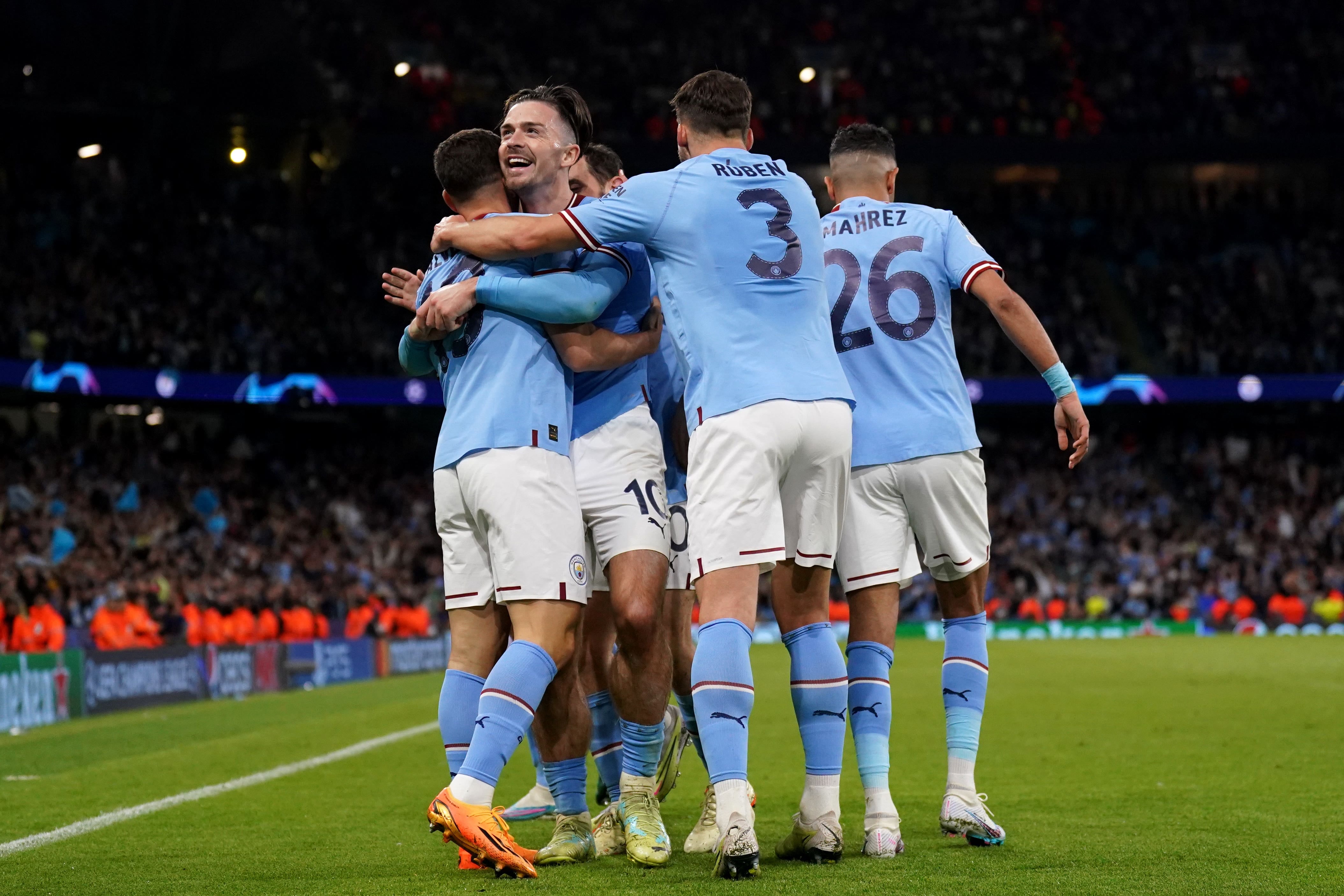 Man City players celebrating a goal