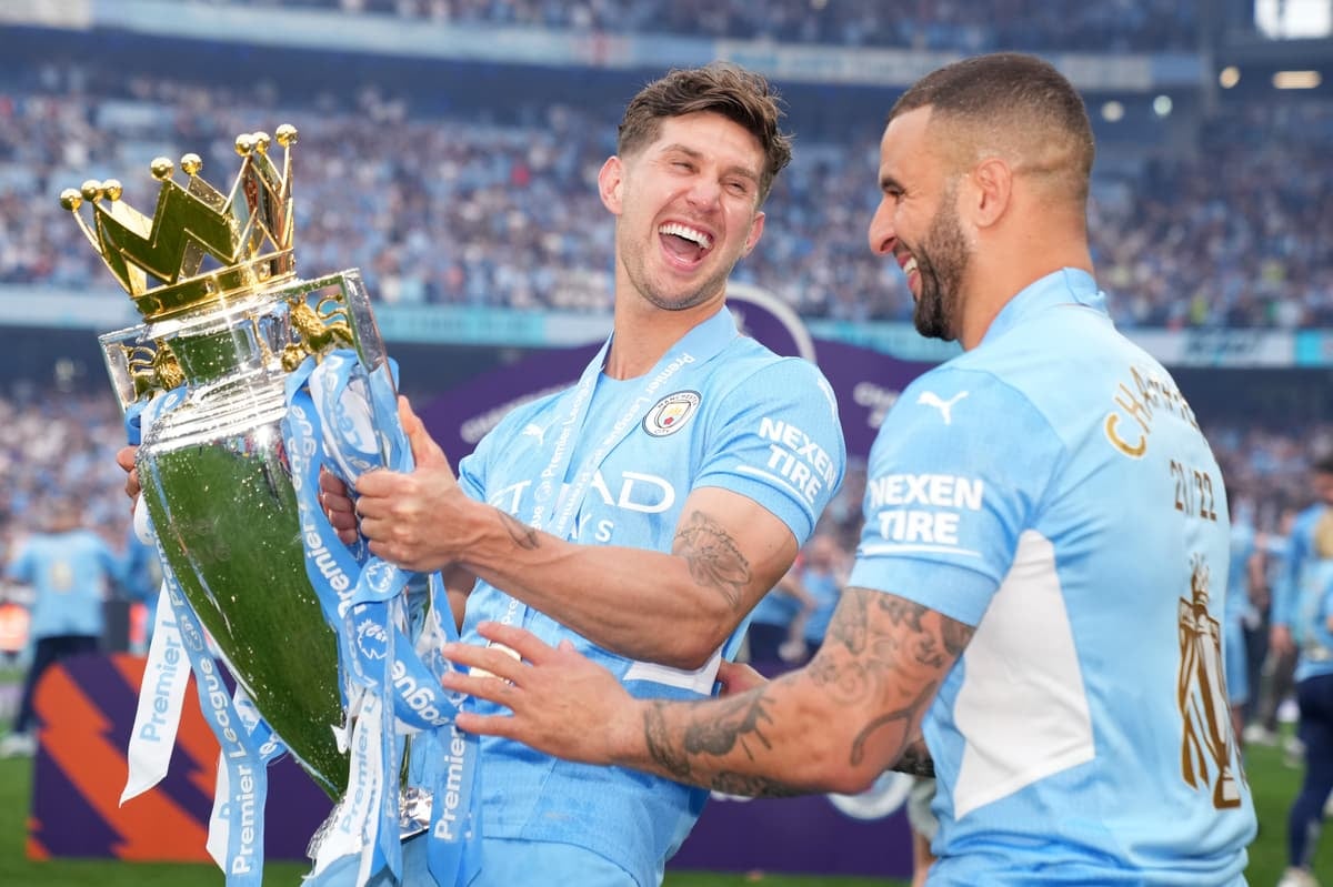 Man City players celebrating a Premier League win